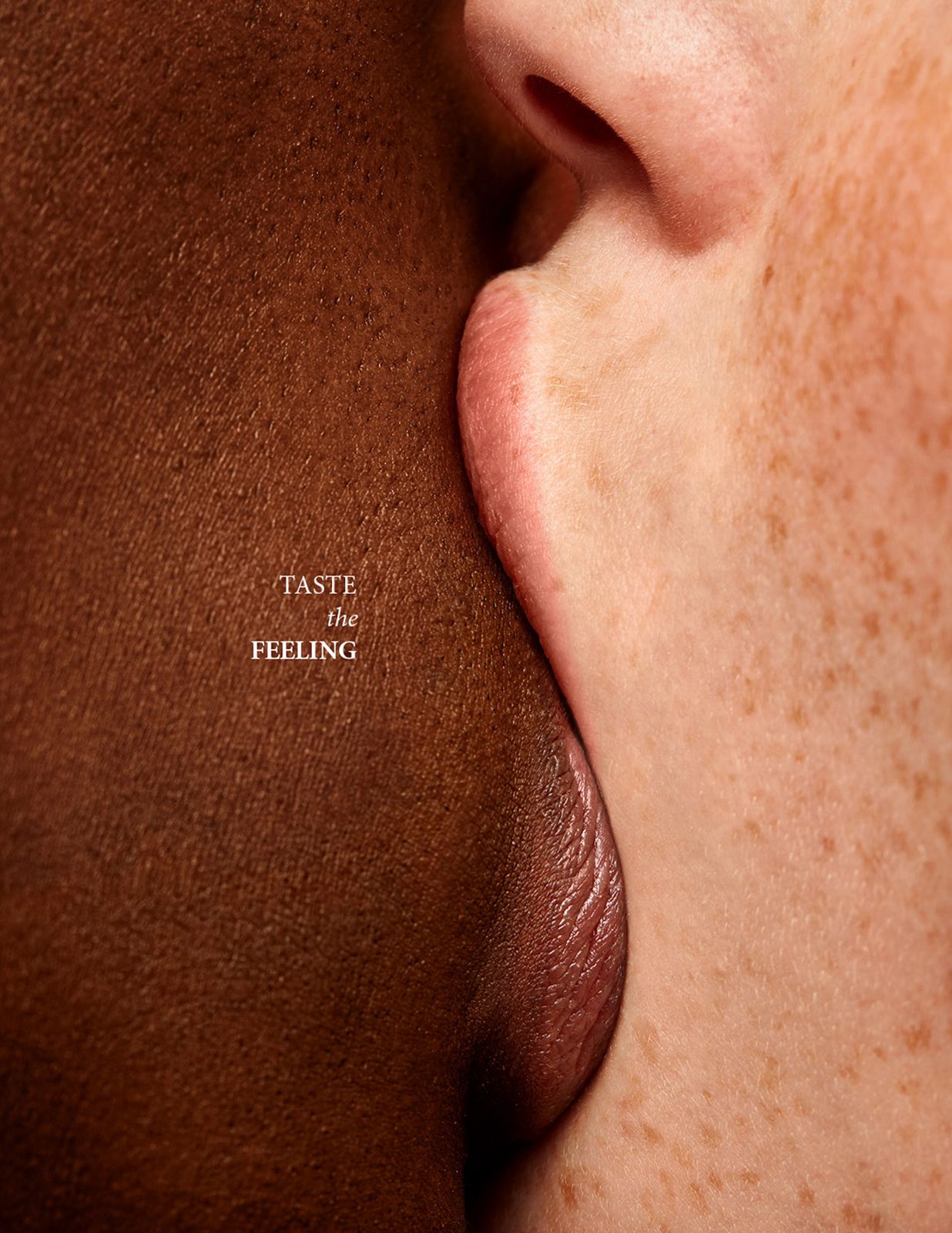 Close-up of contrasting skin tones forming a classic bottle silhouette in negative space