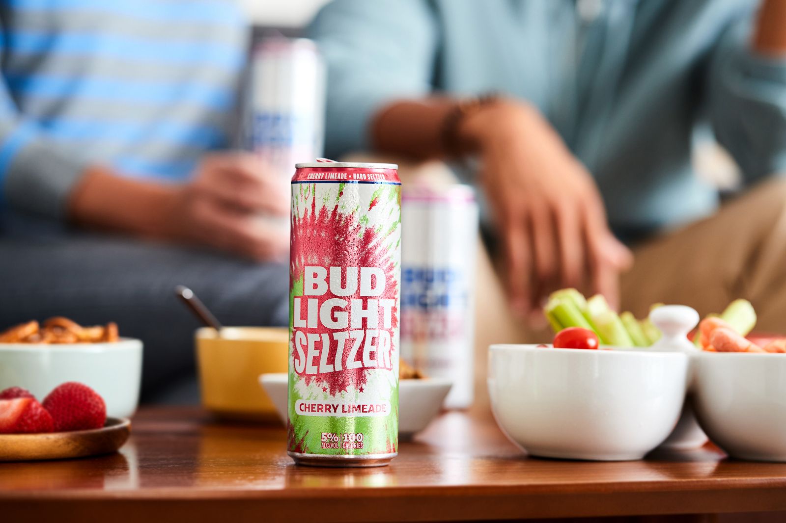 Condensation beads brilliantly upon a brightly colored Cherry Limeade can in soft light.